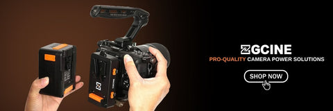 A promotional banner showing a ZGcine camera battery being held by hands next to a camera body, with the ZGcine brand logo and 'SHOP NOW' text on a dark brown and black background.