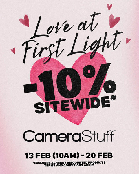 Promotional poster for CameraStuff with a 10% site-wide discount on 'Love at First Light' theme.